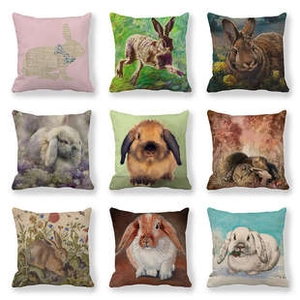 Detail of nine linen Easter pillow covers with diverse artistic rabbit patterns and colors