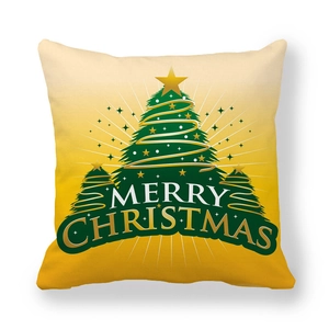 Detail of Christmas peach skin pillow cover featuring gold trees and Merry Christmas text