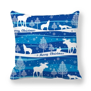 Detailed view of Merry Christmas blue cushion cover with white forest animal silhouettes