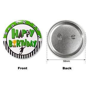 Macro view of 58mm football birthday badge showing front design and metal safety pin back