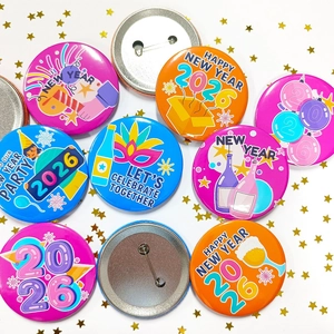 Colorful 2026 New Year tinplate badges with party illustrations on white starry background