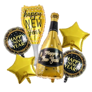 Detail view of New Year balloon set featuring champagne bottle and gold star foil balloons