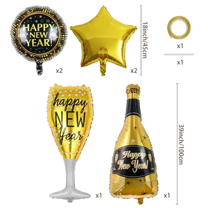 Detailed view of New Year balloon set with champagne bottle and star shapes in black and gold
