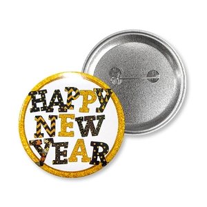 Detailed back and front view of New Year tinplate badges with Happy New Year lettering