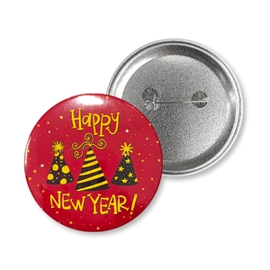 Front and back detail of a tinplate New Year badge with safety pin and festive party design