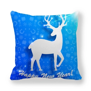 Close-up of Happy New Year text and white reindeer pattern on blue velvet pillowcase