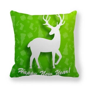 Detail of green reindeer pillowcase with festive snowflakes and Happy New Year text