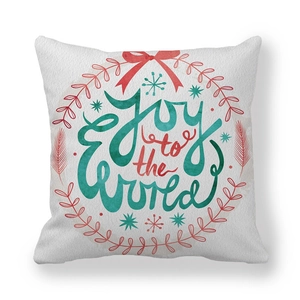 Peach skin pillow cover with Joy to the World Christmas wreath print on white background