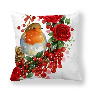Christmas robin cushion cover with red roses, berries and pine cones on white background