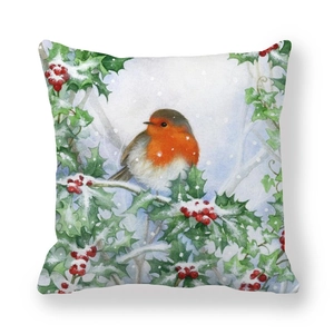 Macro detail of Christmas robin cushion cover with soft watercolor berry branch print