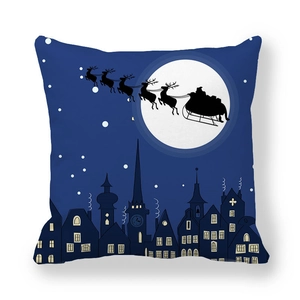 Detailed Christmas pillow case showing Santa and reindeer silhouette over a dark night town