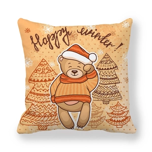Detail of square pillowcase with cartoon bear in red Santa hat and Happy Winter text