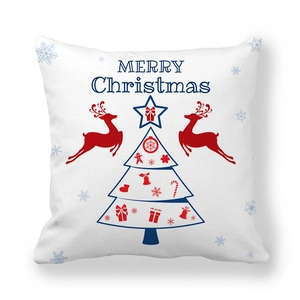 Detail of Christmas pillowcase with red reindeer and geometric tree on white fabric