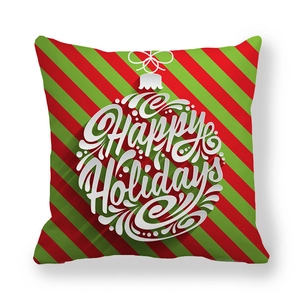 Detail of red and green striped Christmas pillowcase with Happy Holidays print