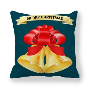 Detail of Christmas pillowcase with golden bells and Merry Christmas ribbon on blue