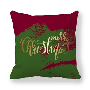 Détail de la taie d'oreiller de Noël rouge et vert avec lettrage doré Merry Christmas