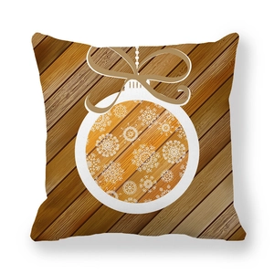 Close-up of snowflake Christmas ornament print on wood texture peach skin cushion
