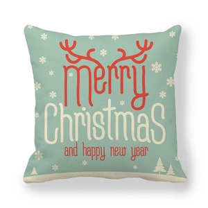 Detail of mint green Christmas pillowcase with red antlers and Merry Christmas text