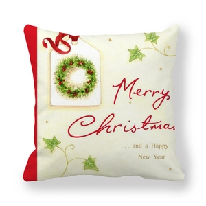 Detail of Christmas wreath pillowcase with red piping and Merry Christmas text
