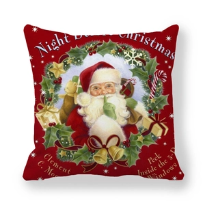 Close-up of red Christmas pillowcase with vintage Santa Claus and wreath illustration