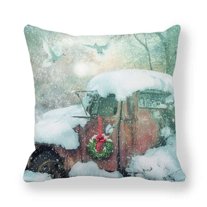 Close-up of peach skin fabric texture with vintage red Christmas truck print on pillowcase