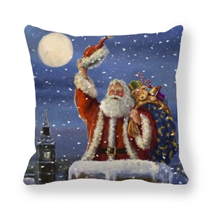 Détail d'une housse de coussin de Noël avec le Père Noël, sac de cadeaux et décor enneigé