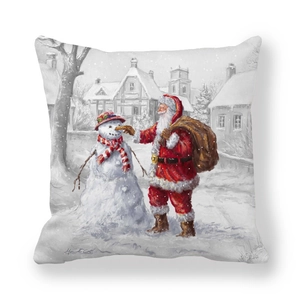 Detail of Christmas pillow cover with Santa Claus and snowman in snowy village scene