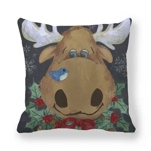 Detail of Christmas peach skin pillow cover with elk, birds and holly berries pattern