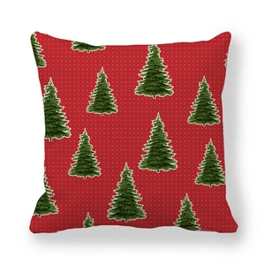 Close-up of peach skin fabric Christmas pillowcase with red base and green tree pattern