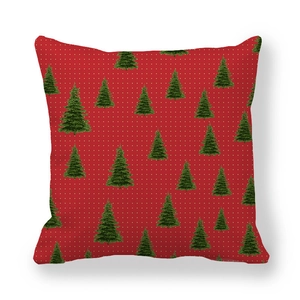 Close-up of red Christmas tree pillowcase with white dots and green pine patterns