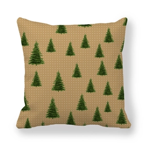Close-up of green Christmas tree pattern on peach skin fabric cushion cover
