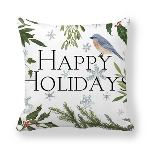 Macro detail of Happy Holidays peach skin cushion cover with bird and pine branch motif