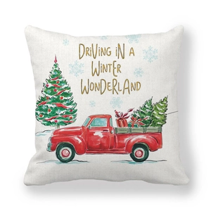 Detail of Christmas pillowcase with red truck and driving in a winter wonderland text