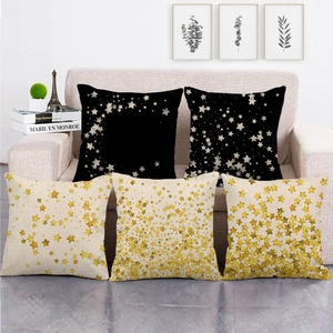 Five-piece square linen cushion covers with gold star print on black and beige fabric