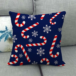 Detailed texture of blue Christmas cushion cover with candy cane and snowflake prints