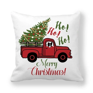 Close-up of a Christmas peach skin pillowcase with a red vintage truck and tree motif