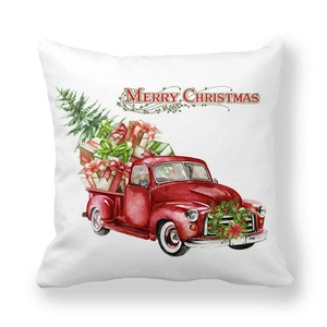 Christmas pillow cover featuring a red vintage truck with Xmas trees and gifts on white