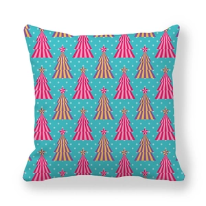 Close-up of peach skin fabric texture with festive Christmas tree pattern on pillowcase