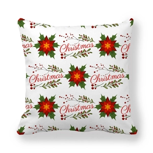 Detail of Christmas peach skin pillowcase with red poinsettia and festive lettering