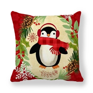 Christmas pillowcase with festive penguin in red scarf and wreath on linen fabric
