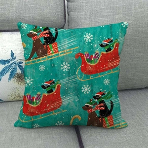 Detail of Christmas dog linen pillowcase showing fabric texture on a grey sofa