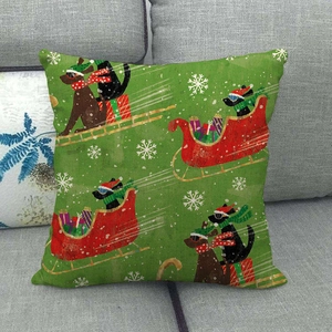 Close-up of Christmas dog linen pillowcase with snowflake and sleigh patterns on a sofa