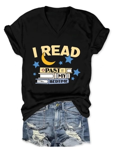 Detail of V-neck black T-shirt with I Read Past My Bedtime print and denim shorts