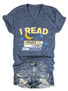 Detail of V-neck heather blue tee featuring I Read Past My Bedtime text and moon art