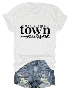 Detail of white cotton T-shirt with just a small town nurse print and ripped denim shorts