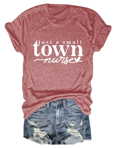 Flat lay of a heather red nurse t-shirt paired with distressed denim shorts