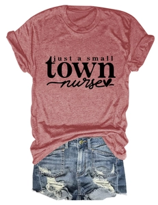 Flat lay view of a dark red heather T-shirt featuring nurse print and denim shorts outfit