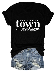 Flat lay of black nurse t-shirt with denim shorts showing casual summer outfit style