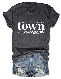 Close-up of charcoal gray t-shirt with Just a Small Town Nurse text and denim shorts