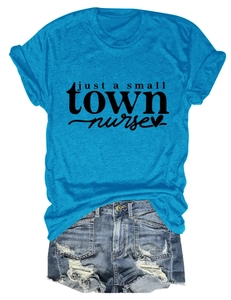 Detail of teal cotton T-shirt with 'just a small TOWN nurse' text and distressed denim shorts